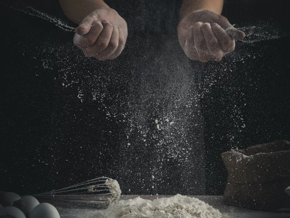 Flour falling from a cook's hands at Ann's Smart School of Cookery, Bond Street Chelmsford